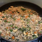Vegan fried rice in a black pan.