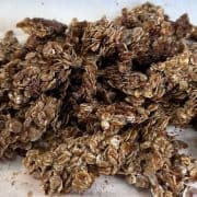 Crisp carob oat clusters in a small pile.