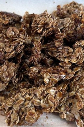 Crisp carob oat clusters in a small pile.